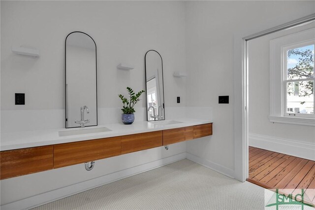 114 W Bolton St, Savannah, GA 31401 - bathroom with double vanity and baseboards