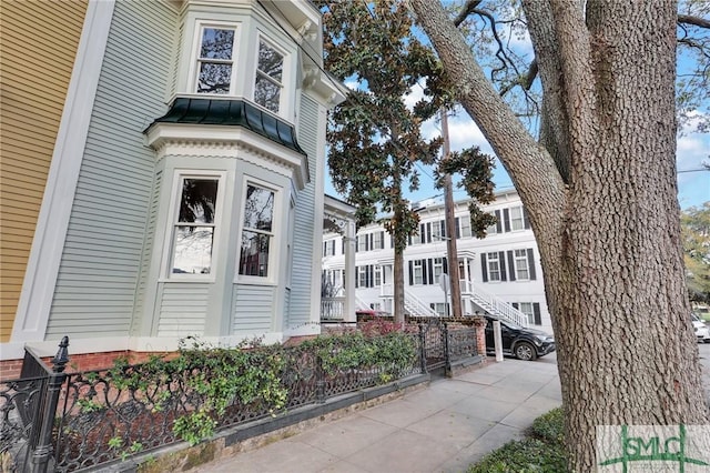 114 W Bolton St, Savannah, GA 31401 - view of front of house featuring a standing seam roof and metal roof