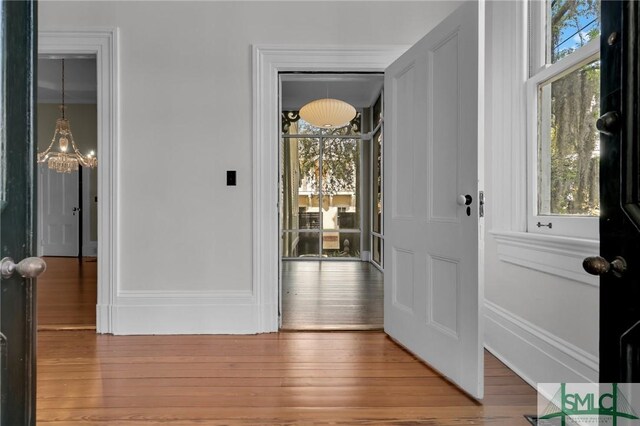 114 W Bolton St, Savannah, GA 31401 - entryway with a chandelier and wood finished floors