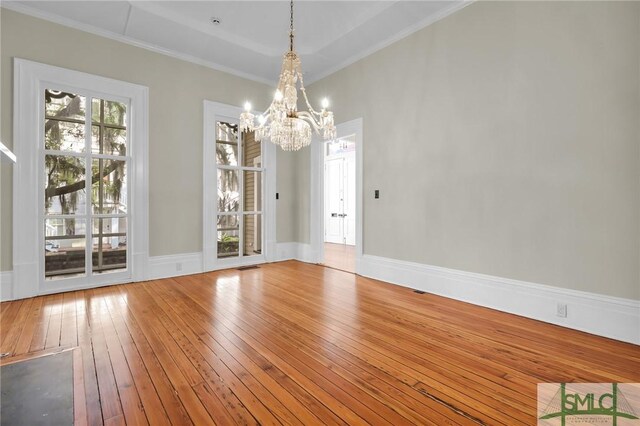 114 W Bolton St, Savannah, GA 31401 - unfurnished room featuring a chandelier, hardwood / wood-style floors, and crown molding