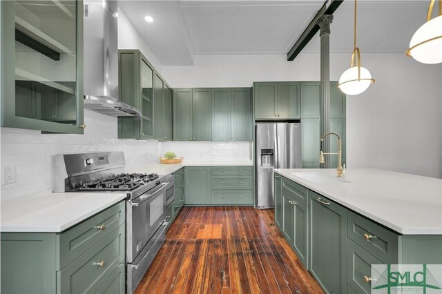 114 W Bolton St, Savannah, GA 31401 - kitchen featuring green cabinets, stainless steel appliances, a sink, wall chimney range hood, and recessed lighting