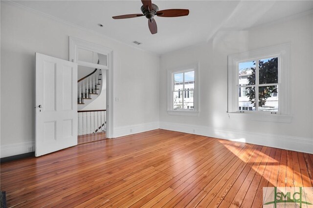 114 W Bolton St, Savannah, GA 31401 - empty room featuring light wood-type flooring, ceiling fan, and baseboards