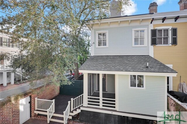 114 W Bolton St, Savannah, GA 31401 - rear view of house with a chimney and fence