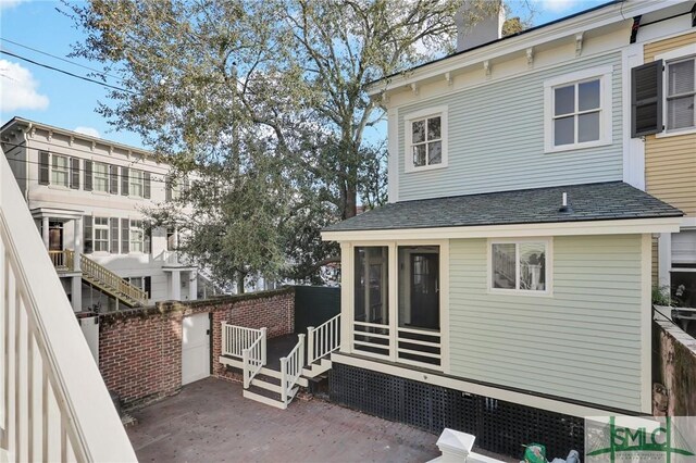 114 W Bolton St, Savannah, GA 31401 - back of property featuring a sunroom and a chimney