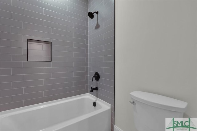 bathroom with toilet and bathing tub / shower combination