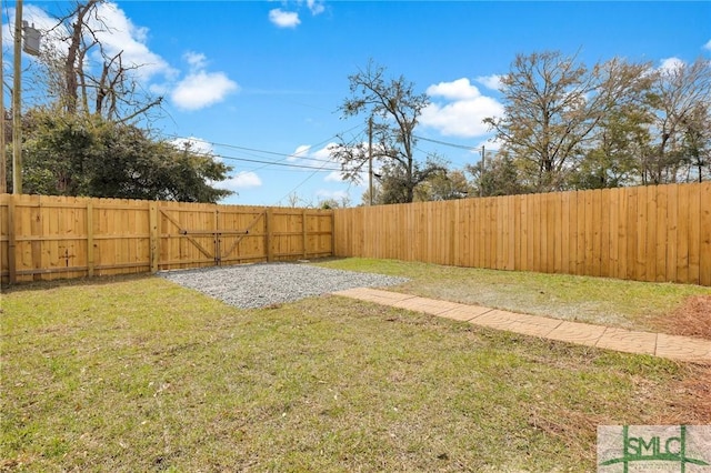 view of yard featuring a fenced backyard