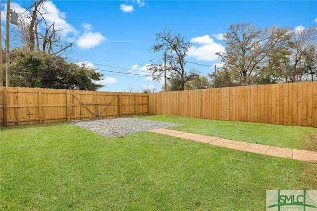 view of yard with a fenced backyard