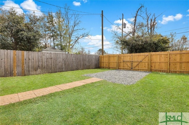 view of yard with a fenced backyard