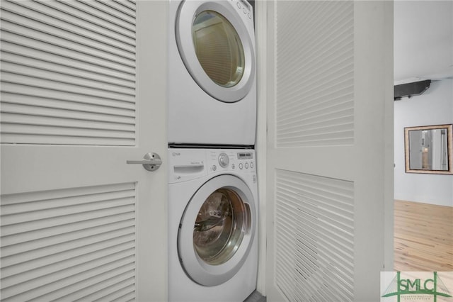 laundry area featuring laundry area and stacked washing maching and dryer