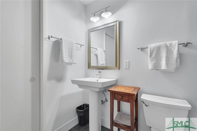 bathroom with tile patterned floors and toilet