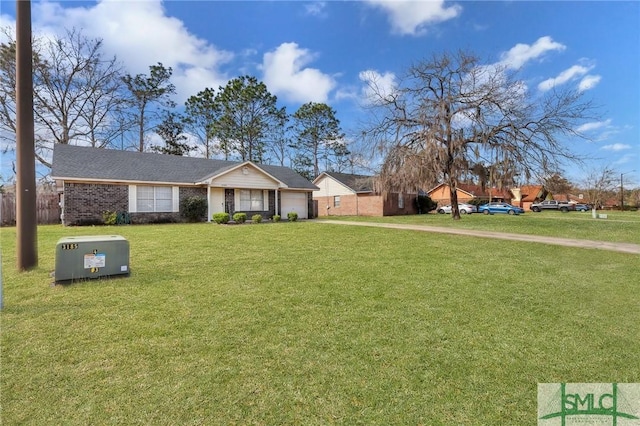 ranch-style house featuring a front yard and an attached garage