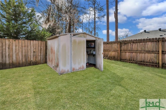 view of shed featuring a fenced backyard