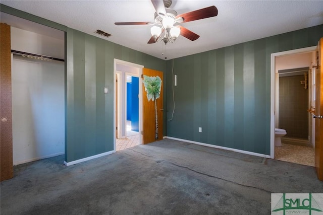 unfurnished bedroom featuring a closet, visible vents, carpet flooring, and baseboards