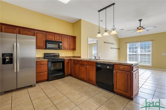 kitchen with a ceiling fan, a peninsula, light tile patterned flooring, black appliances, and decorative light fixtures