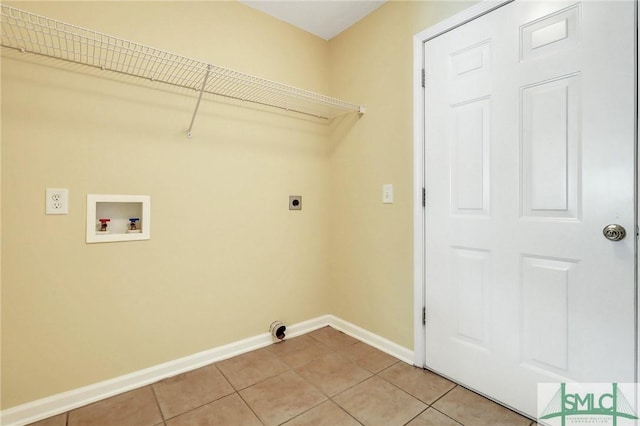 laundry room featuring light tile patterned flooring, baseboards, hookup for an electric dryer, hookup for a washing machine, and laundry area