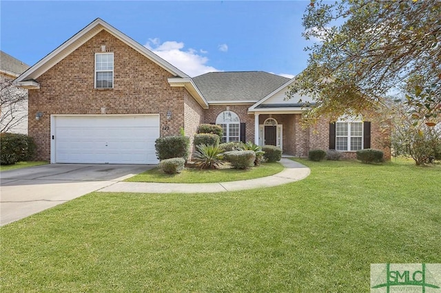 traditional home with a front yard, brick siding, and driveway