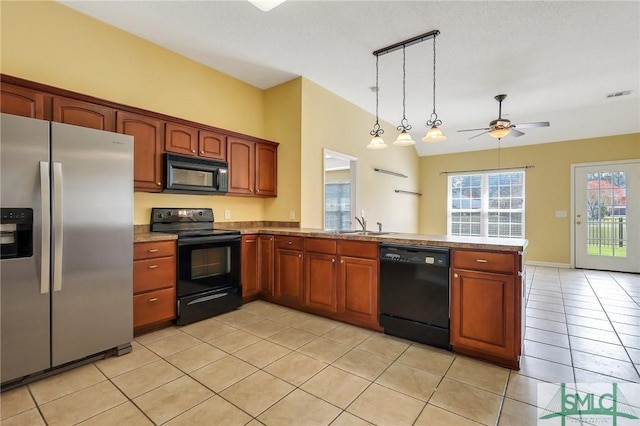 kitchen with visible vents, light tile patterned floors, a peninsula, black appliances, and a ceiling fan