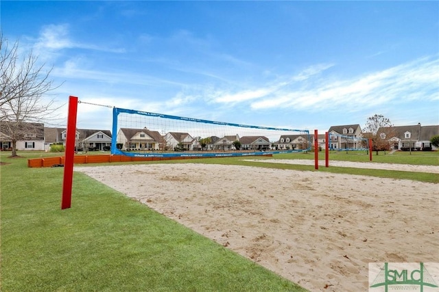 view of property's community featuring volleyball court, a residential view, and a yard