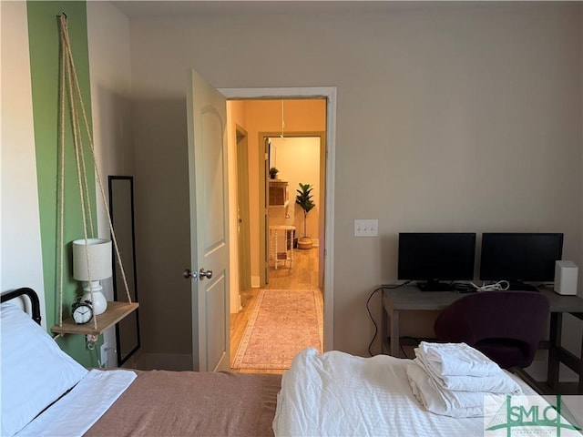 bedroom featuring wood finished floors