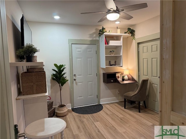 entrance foyer with a ceiling fan and light wood-style floors