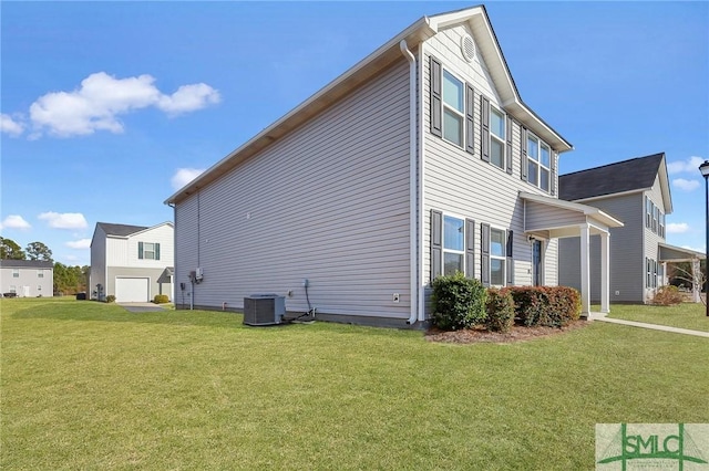 view of property exterior with central AC unit and a lawn