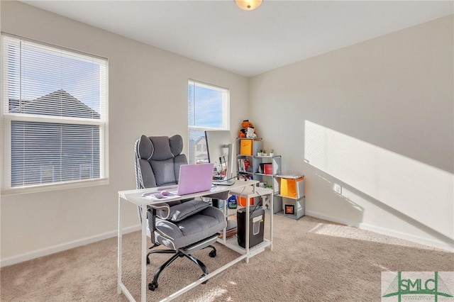 carpeted office with baseboards