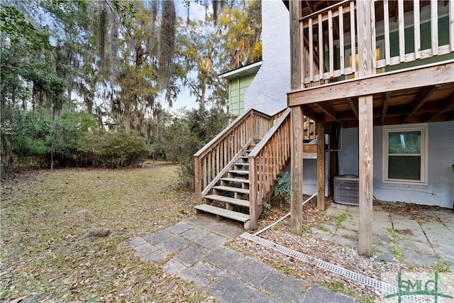 view of yard with stairway and cooling unit