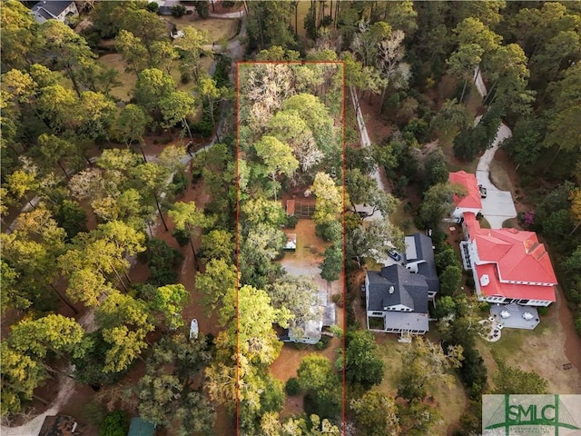 drone / aerial view featuring a view of trees