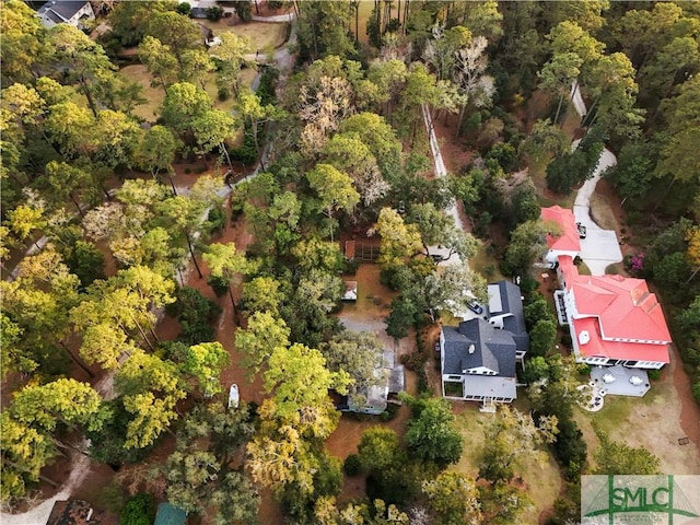 birds eye view of property with a forest view