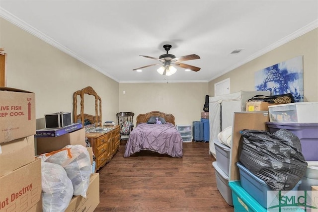 bedroom with a ceiling fan, crown molding, wood finished floors, and visible vents