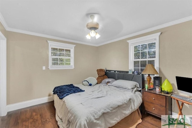 bedroom featuring ornamental molding, baseboards, and wood finished floors