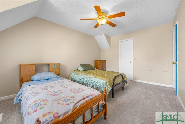 bedroom with vaulted ceiling, baseboards, carpet floors, and a textured ceiling