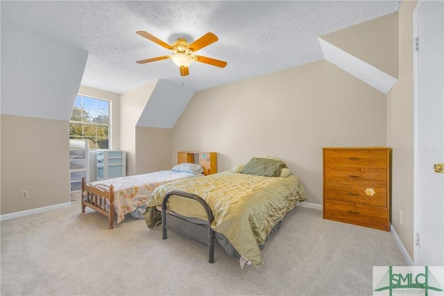 carpeted bedroom featuring ceiling fan, a textured ceiling, baseboards, and vaulted ceiling