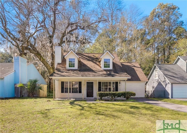 cape cod house featuring a porch, driveway, and a front yard