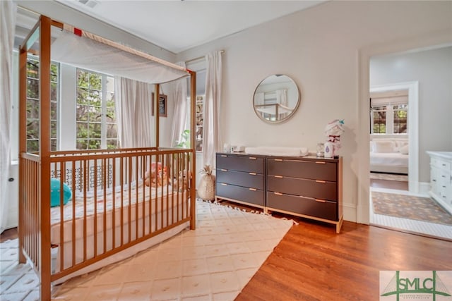 bedroom with wood finished floors