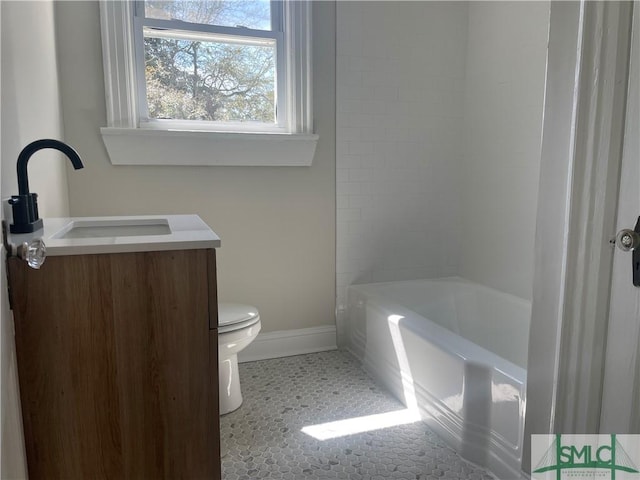 full bath featuring tile patterned flooring, baseboards, toilet, shower / tub combination, and a sink