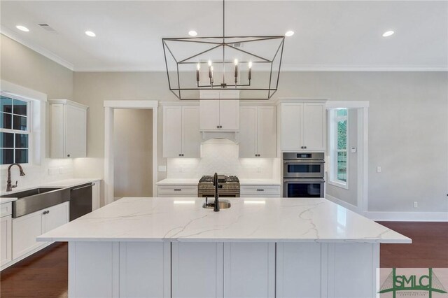 126 Carapace Ct, Richmond Hill, GA 31324 - kitchen with tasteful backsplash, white cabinetry, stainless steel appliances, and a sink