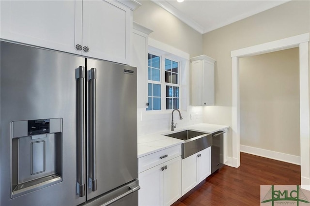 126 Carapace Ct, Richmond Hill, GA 31324 - kitchen with a sink, light stone counters, white cabinetry, stainless steel appliances, and dark wood-style flooring