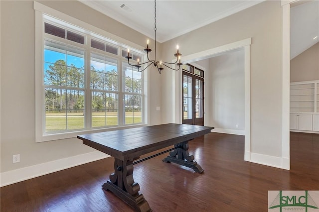 126 Carapace Ct, Richmond Hill, GA 31324 - unfurnished dining area featuring baseboards, an inviting chandelier, wood finished floors, and ornamental molding