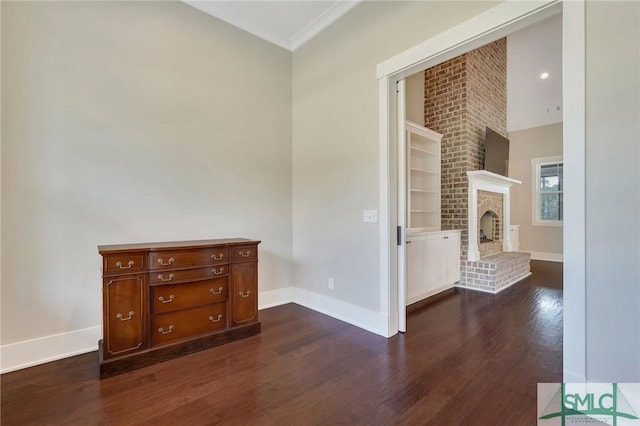 126 Carapace Ct, Richmond Hill, GA 31324 - spare room with dark wood-type flooring, a fireplace, and baseboards