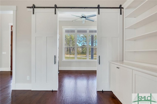 126 Carapace Ct, Richmond Hill, GA 31324 - interior space featuring dark wood-style floors, baseboards, and a barn door