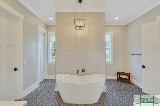 126 Carapace Ct, Richmond Hill, GA 31324 - bathroom featuring recessed lighting, a freestanding tub, baseboards, and a notable chandelier