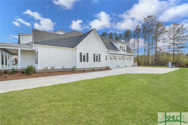 126 Carapace Ct, Richmond Hill, GA 31324 - view of home's exterior with driveway, an attached garage, a shingled roof, a lawn, and board and batten siding