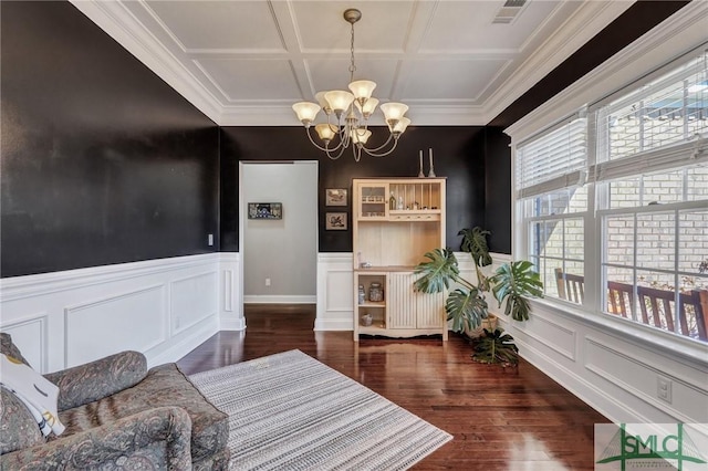 living area with a chandelier, visible vents, coffered ceiling, and a wealth of natural light