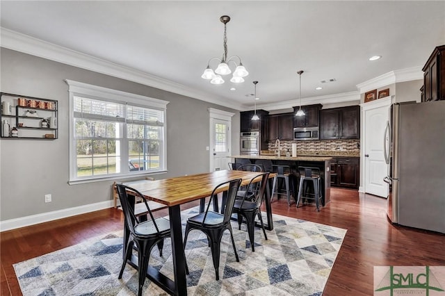 dining space featuring baseboards, a chandelier, ornamental molding, recessed lighting, and dark wood-style floors