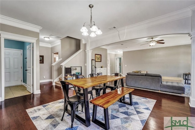 dining area with decorative columns, hardwood / wood-style floors, a ceiling fan, and stairway