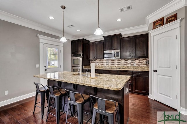 kitchen with visible vents, tasteful backsplash, appliances with stainless steel finishes, and dark wood-style flooring