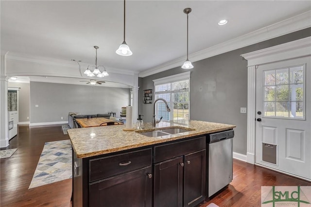 kitchen featuring dark wood-style floors, a sink, dishwasher, and decorative columns