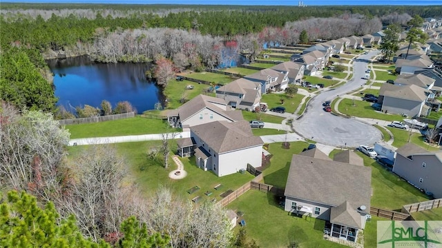 drone / aerial view with a residential view and a water view