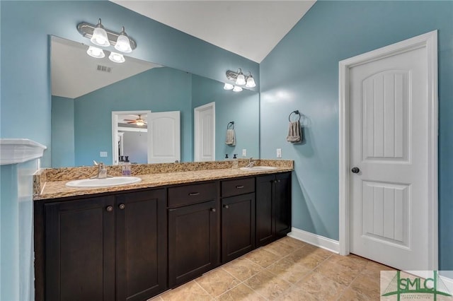 full bath featuring vaulted ceiling, visible vents, and a sink